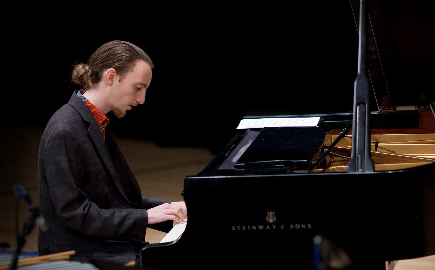 Nick VanAmburg playing piano